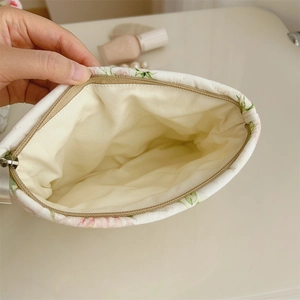 Hand opening floral cosmetic bag with cotton lining and spacious inner compartment
