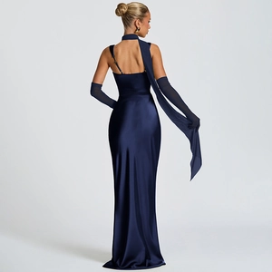 Rear view of sleek navy blue satin evening gown with backless design and long gloves