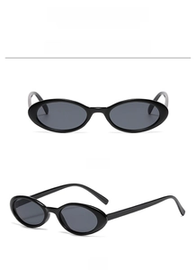 Front and 45-degree angle view of minimalist small oval black sunglasses with black lenses