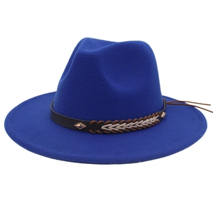 Detailed close-up of wool fedora hat with brown woven leather band and metal accents