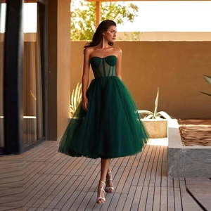 Elegant strapless dark green mesh evening dress featuring a corset bodice and A-line skirt