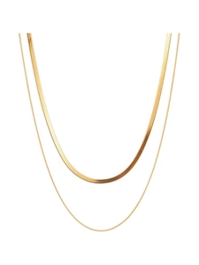 Close-up of a double-layered gold snake bone chain and fine link necklace for women