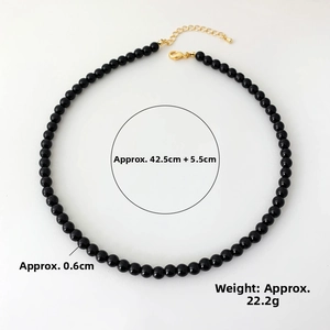 Detail of black onyx beaded necklace showing 0.6cm bead diameter and 42.5cm chain length