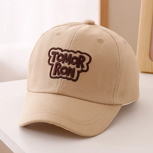 Close-up of beige twill cotton baseball cap with brown TOMORROW embroidery
