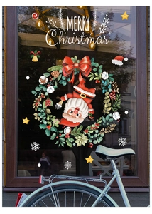 Detail of Christmas window decals featuring Santa, wreath and white snowflake stickers