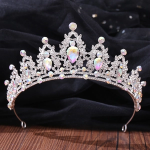 Detailed view of silver bridal crown with iridescent AB crystals and teardrop gems