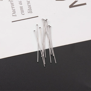 Macro shot of silver stainless steel T-pins for jewelry making and DIY crafts