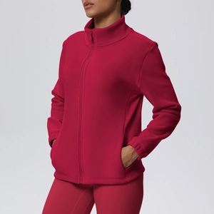 Close-up of the polar fleece fabric texture and high-neck zipper detail on sports jacket