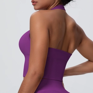 Detail view of deep purple racerback sports bra with high-elastic compression knit fabric