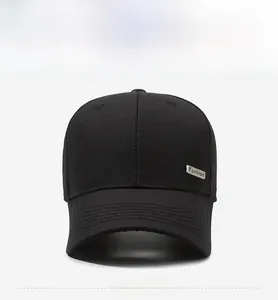 Close-up of black baseball cap featuring a silver metallic Fashion logo on knit fabric