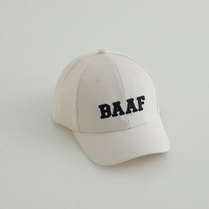 Detailed view of black BAAF letter embroidery on high-quality beige cotton twill fabric