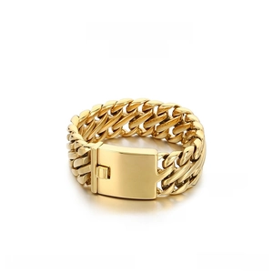 Detailed view of 23mm golden stainless steel woven bracelet with large mechanical clasp
