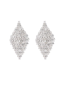 Macro shot of silver diamond geometric rhombus earrings with shimmering pavé crystal details
