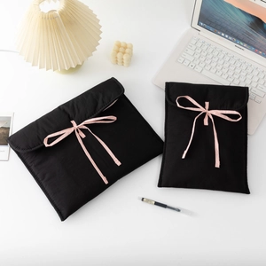 Quilted black laptop and tablet sleeve set with pink ribbons for 11 and 13 inch devices