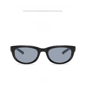 Front view of classic black cat-eye sunglasses with gray lenses and a glossy frame