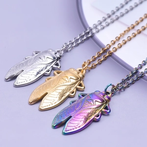 Three cicada pendants in gold, silver, and rainbow steel with fine wing engravings