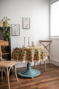 Detailed view of sunflower jacquard fabric with elegant beige cotton tassel edges
