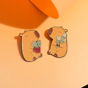 Creative enamel Capybara pins with orange background and cute floral animal design
