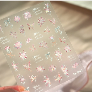 Detailed macro view of laser holographic butterfly and floral nail art stickers M-941