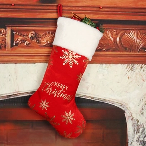 Red velvet Christmas stocking with gold Merry Christmas print and faux fur trim