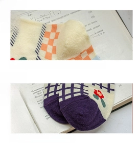 Macro detail of cotton socks featuring reinforced heels and flat seamless toe stitching