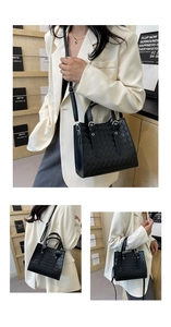 Three-way view of a black quilted tote bag with silver hardware and shoulder strap