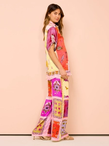 Full side view of silk-like satin printed shirt and wide-leg trousers casual set