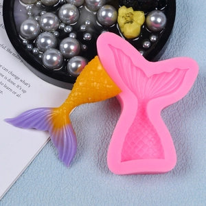 Detail of pink silicone mermaid tail mold showing fine scale textures and gradient finish
