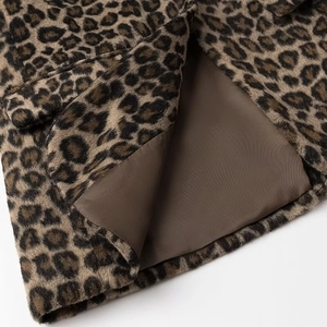 Close-up detail of leopard print faux fur fabric and high-quality dark brown inner lining
