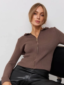 Detail shot of brown ribbed knit sweater featuring a metallic zipper and slim fit texture