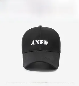 Front view of black cotton baseball cap with white ANED embroidery and curved brim