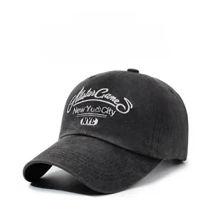 Close-up of white 3D embroidery with New York City text on vintage washed baseball cap