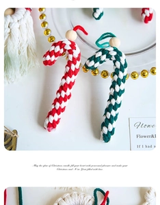 Macro detail of handmade woven cotton candy cane ornaments with wooden beads
