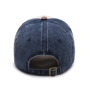 Vintage washed navy blue baseball cap with adjustable metal buckle and contrast brown button