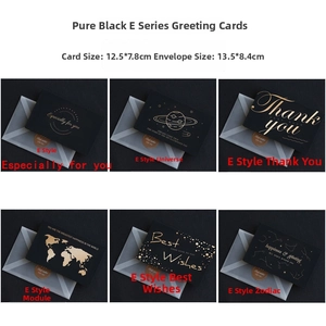 Detail view of gold foiled black greeting cards with translucent envelopes and star map motifs