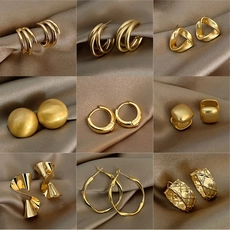 Detailed collection of golden geometric earrings featuring various stylish textures and shapes