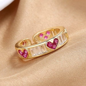 Pink heart-shaped gem open ring with gold band and rectangular cubic zirconia accents
