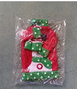 Detail of Christmas wine bottle cover with snowman embroidery in transparent packaging