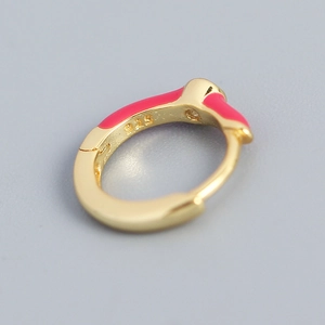 Gold-plated S925 silver hoop earring with vibrant pink enamel inlay in a macro view