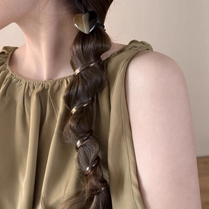 Brown heart spiral hair tie set shown on model for elegant bubble braid styling