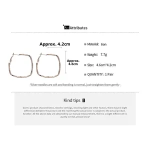 Detail view of twisted square hoop earrings in rose gold with size and weight specs