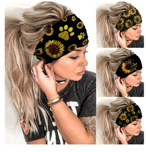 Detail showing various sunflower and paw print patterns on stretchy elastic headbands