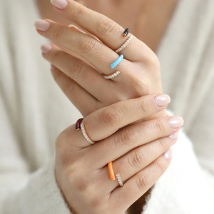 Detail of colorful enamel double layer rings with micro-pave cubic zirconia on hand