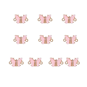 Detail of ten pink acrylic butterfly pendants with inlaid crystals and gold alloy rings
