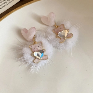 Detail of pink plush bear earrings with heart studs and sparkling rhinestone accents