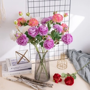 Artistic arrangement of realistic faux roses in purple, pink, and white for home decor