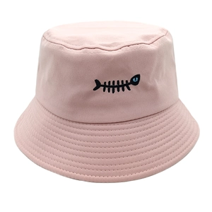 Detail of pink cotton bucket hat featuring black fishbone embroidery and stitched brim