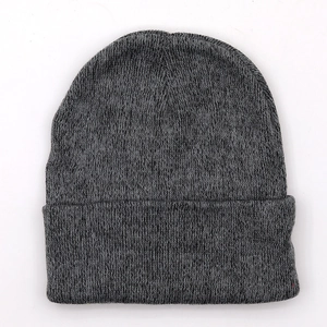 Detailed knit texture of dark grey wool beanie featuring rolled cuff and warm fabric
