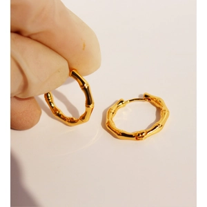 Elegant gold-plated brass bamboo-shaped hoop earrings with a textured surface