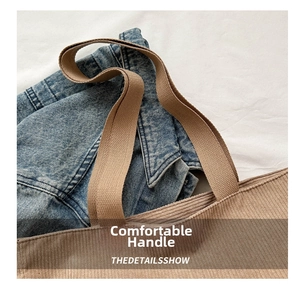 Detail view showing textured corduroy fabric and durable woven handle of the brown tote bag